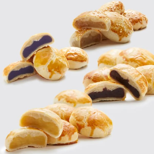 Assortment of Goldilocks hopia pastries with various fillings, some cut open to show the inside.